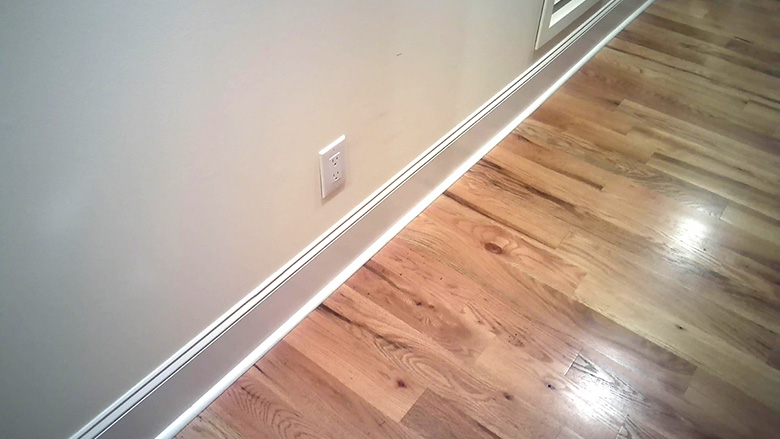 Water behind baseboard
